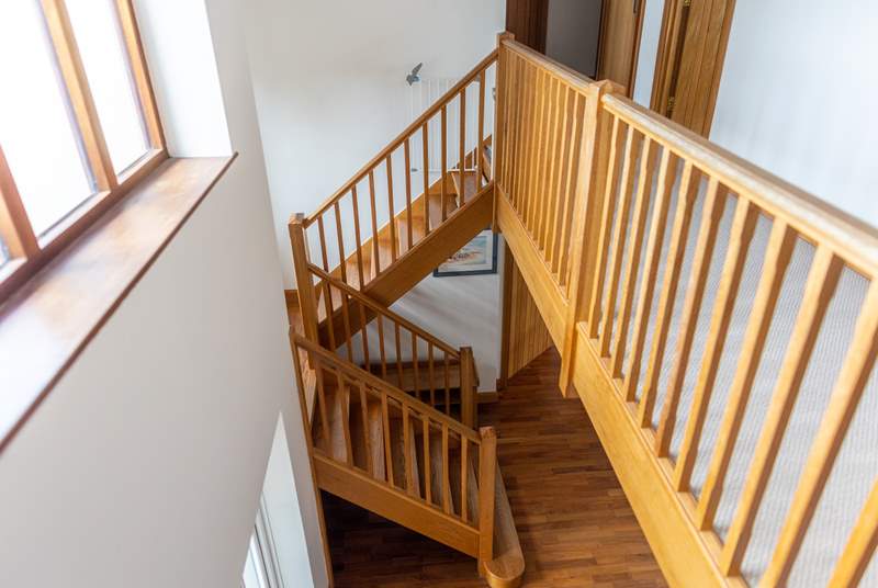 The landing is open and you can install the stair-gate at the top of the stairs as shown in the picture.