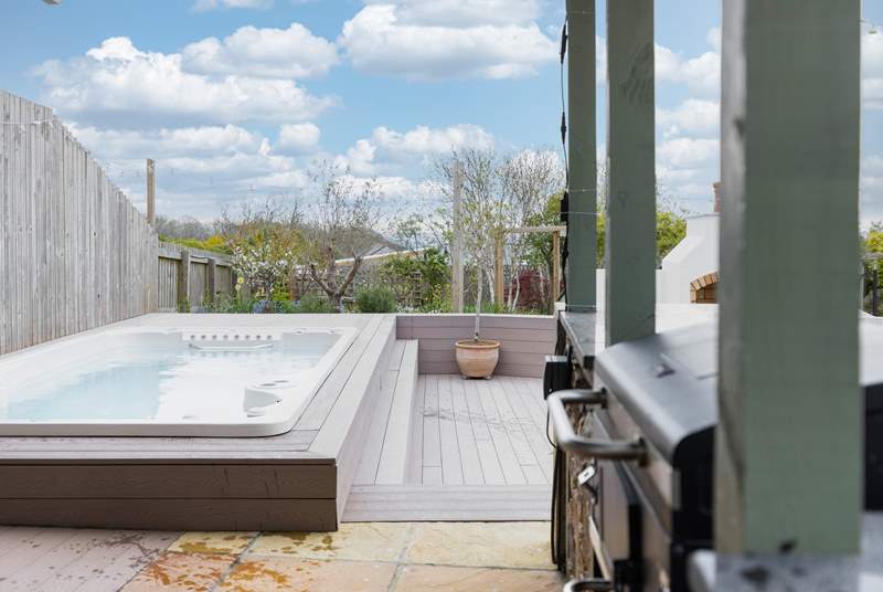 The hot tub sits raised from the main patio area with seating around.  Please do take care when climbing in and out of the tub but most of all sit back and enjoy the luxury underneath the beautiful sky.