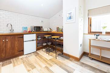 The compact kitchen area has everything you will need.