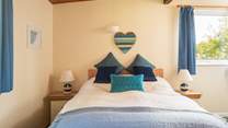The main bedroom enjoys views and an en suite shower.