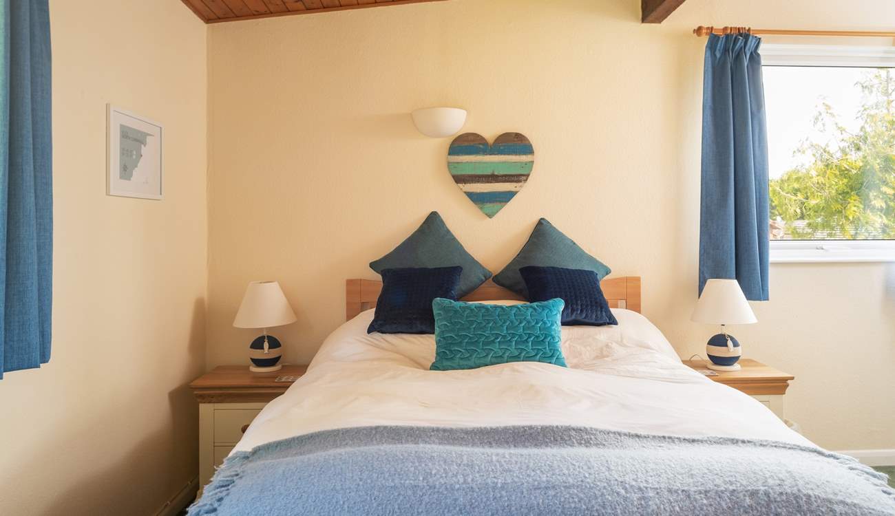 The main bedroom enjoys views and an en suite shower.