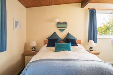 The main bedroom enjoys views and an en suite shower.