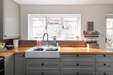 The fully equipped kitchen at the back of the house leads on to the covered courtyard.