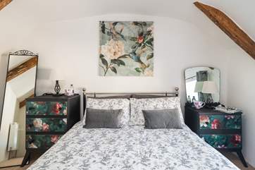 The style of the bedrooms offers a unique edge yet the room retains original charm.