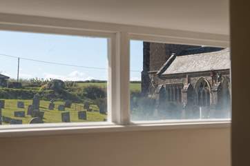 The view from the landing window across to the village church.
