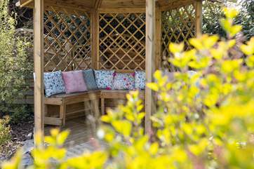 The cushions add a touch of luxury and are stored in the outhouse/utility-area.