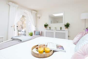 A bedroom that will not fail to impress, with direct access on to the lower section of the garden.