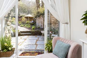 The bedroom offers another way to access the garden, the morning coffee can also be enjoyed at the bistro set.