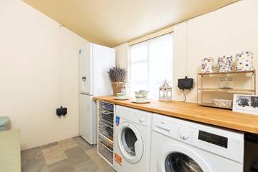 There are washing and drying facilities plus another fridge/freezer.