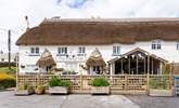 Take a look at the top of the thatched inn - you can see the fox that your cottage is named after. - Thumbnail Image