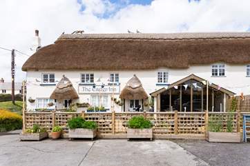 Take a look at the top of the thatched inn - you can see the fox that your cottage is named after.