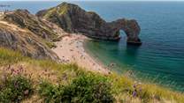 The Durdle Door and lush blue waters are waiting for you.