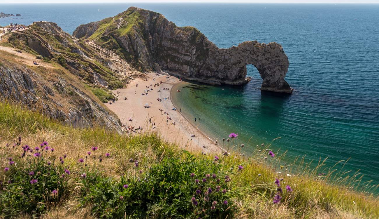 The Durdle Door and lush blue waters are waiting for you.