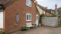 From the stable kitchen door, you can head out to the shared courtyard area. This is also the property's parking space (you will need to park adjacent to the cottage, with the bonnet/boot close up to the wooden structure).