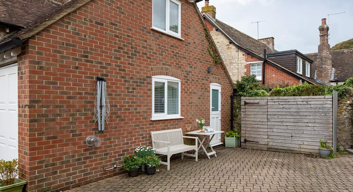 From the stable kitchen door, you can head out to the shared courtyard area. This is also the property's parking space (you will need to park adjacent to the cottage, with the bonnet/boot close up to the wooden structure).