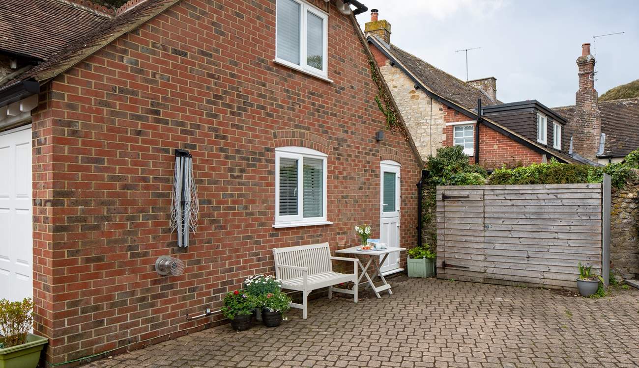 From the stable kitchen door, you can head out to the shared courtyard area. This is also the property's parking space (you will need to park adjacent to the cottage, with the bonnet/boot close up to the wooden structure).
