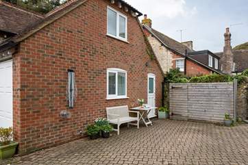 From the stable kitchen door, you can head out to the shared courtyard area. This is also the property's parking space (you will need to park adjacent to the cottage, with the bonnet/boot close up to the wooden structure).