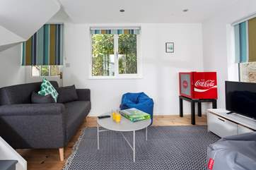 The summer-house is a wonderful escape for the youngsters, they even have their own fridge to chill their favourite drinks in!