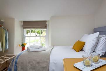 The pretty twin bedroom overlooks the garden.
