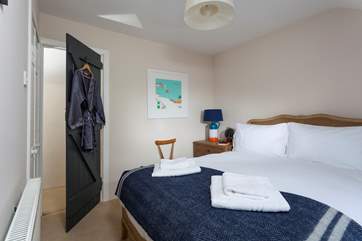 Bedroom two is blissfully calm in grey and cream hues.