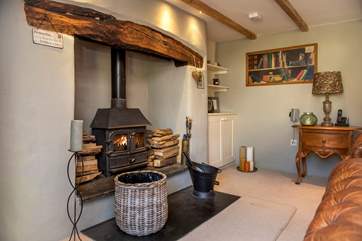 The drawing-room with its impressive inglenook fireplace, home to yet another wood-burning stove.