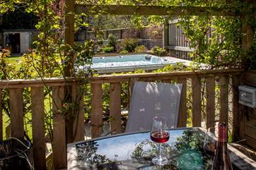 From the decking area you can watch those soaking up the sun in the hot tub.
