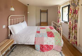 Bedroom two is colourful and charming.