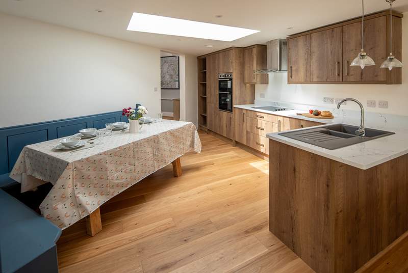 The kitchen and dining area is spacious, airy and seats four guests very comfortably.