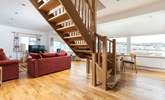 The stairs lead up from the centre of the living space to the first floor bedrooms. - Thumbnail Image