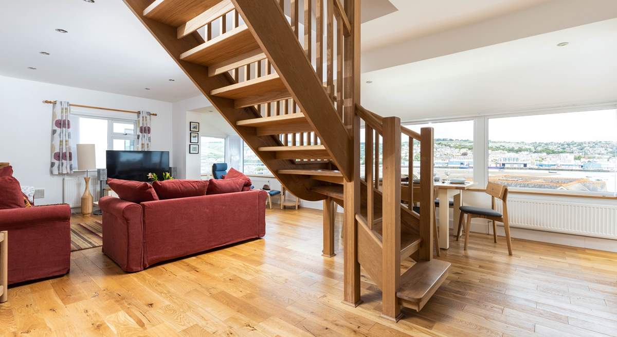 The stairs lead up from the centre of the living space to the first floor bedrooms.