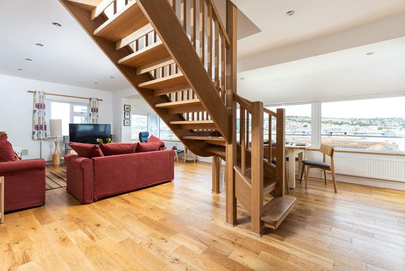 The stairs lead up from the centre of the living space to the first floor bedrooms.