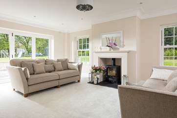 The beautiful sitting-room fills with natural light (the wood-burner is ornamental only).