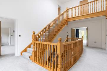 The beautiful staircase leads up to the second floor.