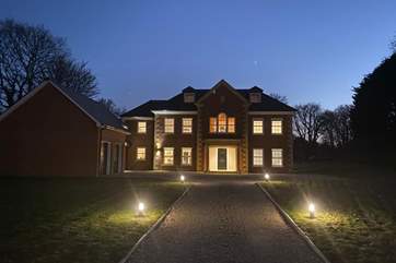 Impressive Willow House looks fabulous at night.