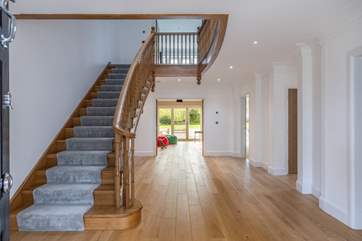 The impressive oak staircase leads to the first floor.
