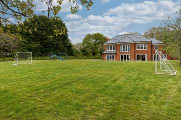 The large garden awaits to be explored, perfect for a game of football.