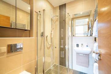 The stylish en suite shower-room to the main bedroom.