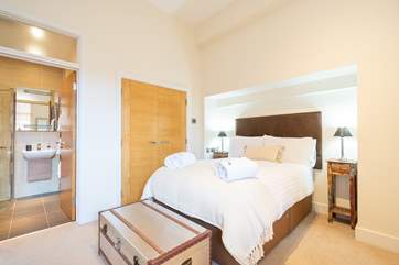 The spacious main bedroom on the ground floor with en suite shower-room.