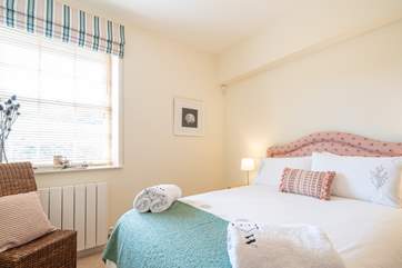 The pretty third bedroom on the ground floor is light and airy.