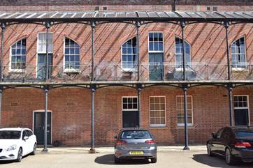 The balcony to The Tap Room faces the central courtyard, space to dine and relax on holiday.