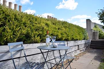 Take a seat on the shared roof terrace with a drink and a good book.