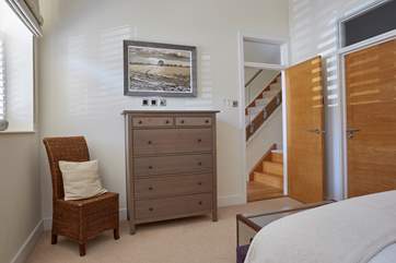 The main bedroom offers an en suite shower-room.