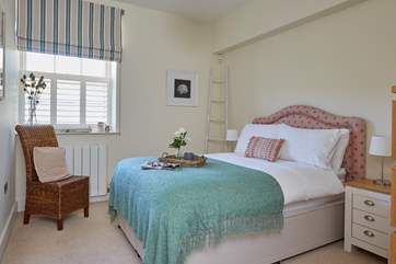 The pretty third bedroom on the ground floor is light and airy.