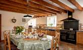 The spacious farmhouse-style kitchen/dining-room. - Thumbnail Image