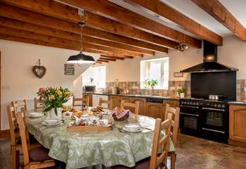 The spacious farmhouse-style kitchen/dining-room.
