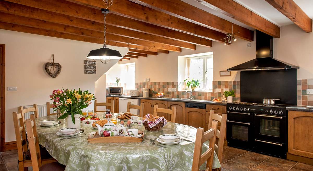 The spacious farmhouse-style kitchen/dining-room.