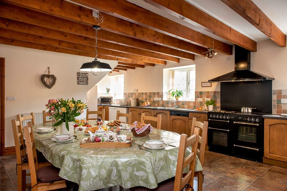 The spacious farmhouse-style kitchen/dining-room.