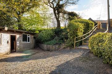 Steps lead down from the garden to the games-room.