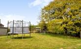 There's a really spacious garden and plenty of play equipment to keep younger members entertained. - Thumbnail Image