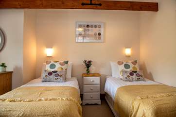 Pretty pastel shades in bedroom 3 which can be set up as twins or...
